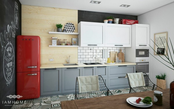 cuisine de l'appartement artistique avec son frigo rouge vif placards table