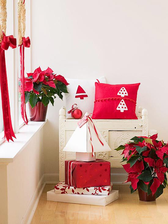 déco-maison-Noël-rubans-rouges-coussins-blanc-rouge-étoile-Noel-boîtes-cadeaux déco en rouge et blanc