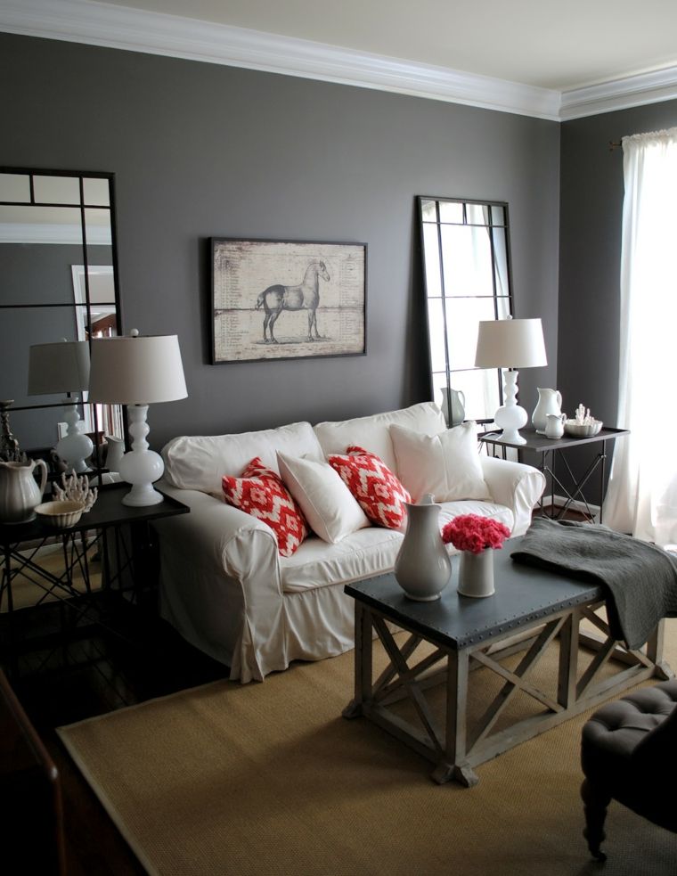salon moderne gris contemporain design canapé blanc coussins oranges rouges déco mur 