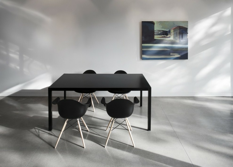 sol béton ciré salle à manger déco minimaliste table noire chaise noire