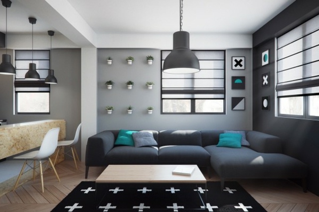 aménager un petit appartement idée canapé d'angle gris design tapis de sol noir luminaire en suspension 