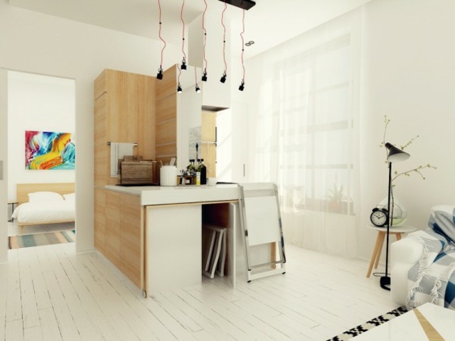 aménager un petit appartement design cuisine moderne îlot central luminaire suspendu tableau mur
