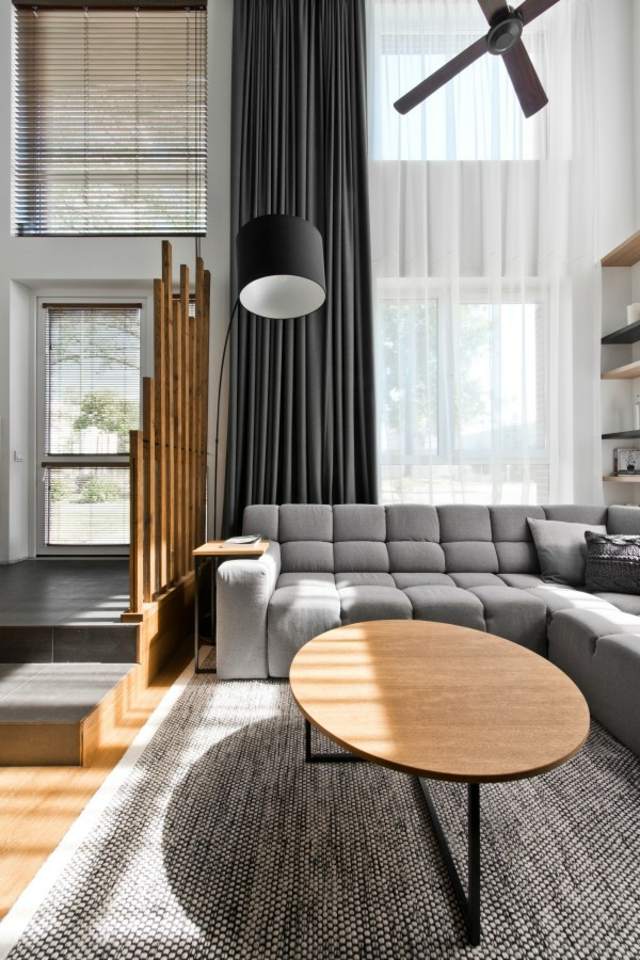 loft contemporain salon design table bois basse tapis de sol canapé d'angle gris
