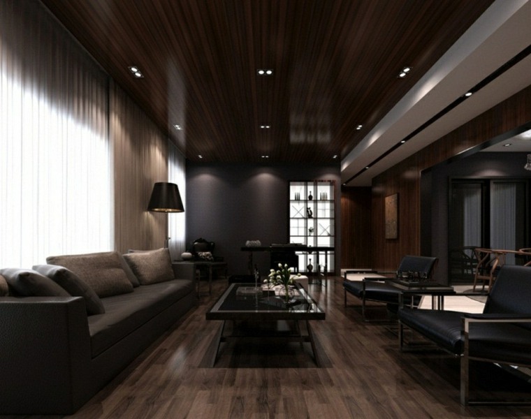 salon contemporain moderne design canapé coussins parquet bois table basse verre fauteuil cuir noir