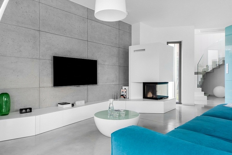 salon design moderne aménagement mur béton luminaire blanc suspension canapé bleu table basse 
