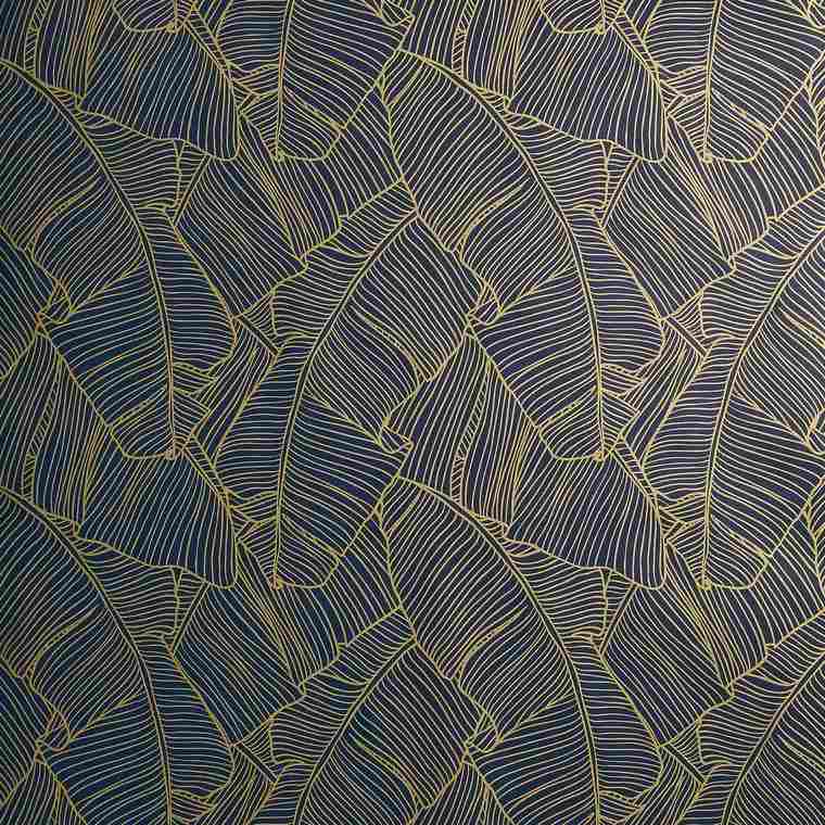 contours dorés feuilles tropicales fond bleu