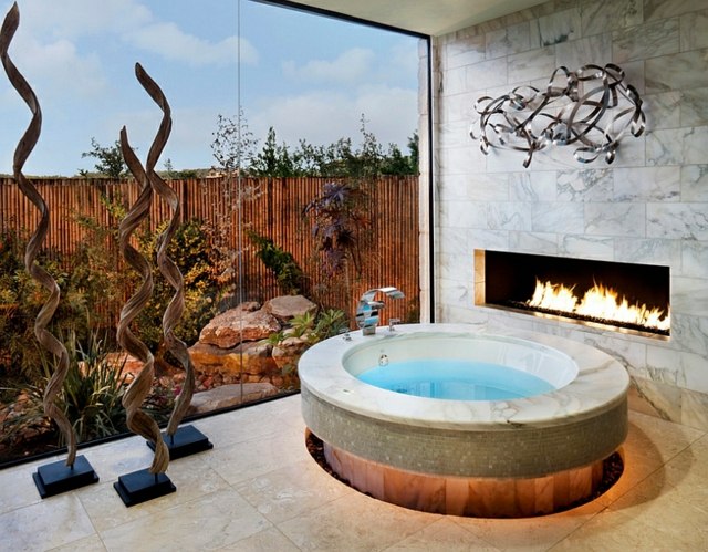 salle de bains spa design marbre rond cheminee feu